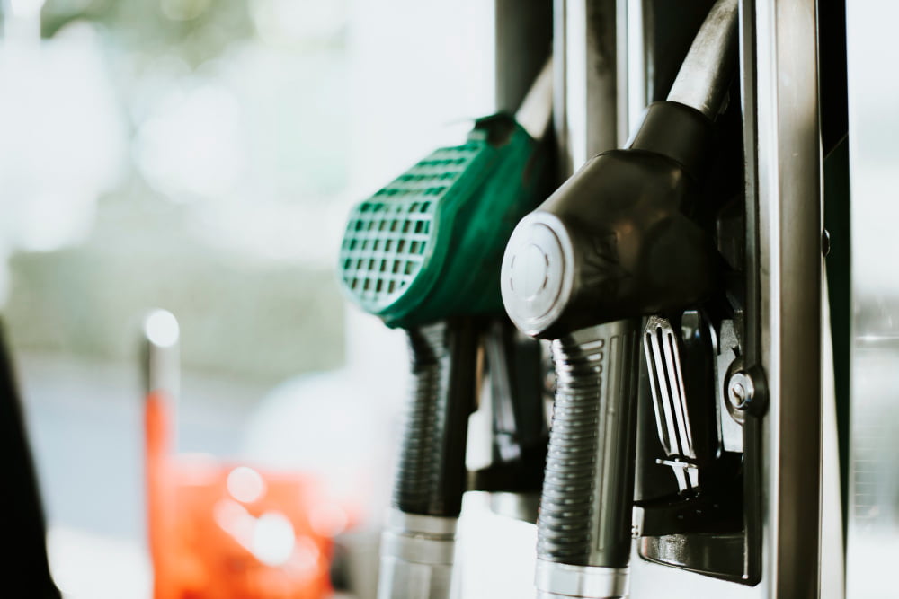 closeup fuel nozzles gas station